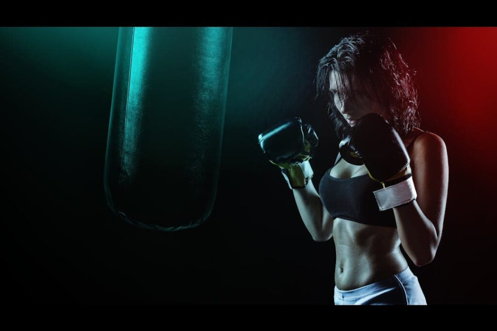 Personal trainer coaching a boxing workout in Sharjah home gym